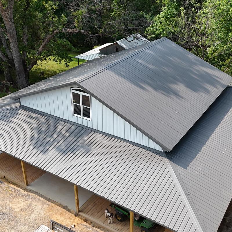 Metal roofing and wood framed porch on new building Metal roofing and wood framed porch on new building