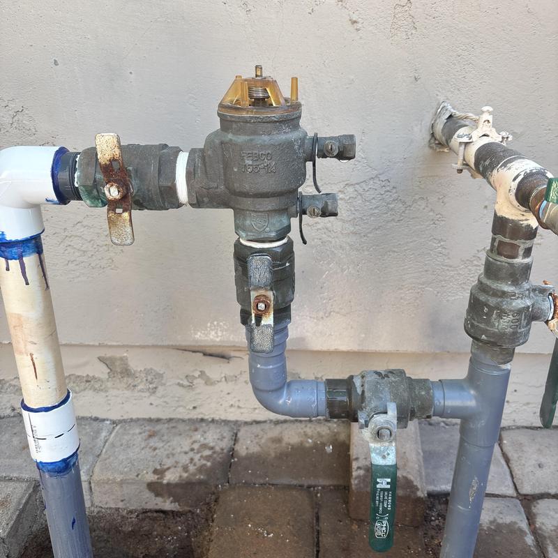 Backflow prevention valve with PVC piping and shutoff handles Backflow prevention valve with PVC piping and shutoff handles