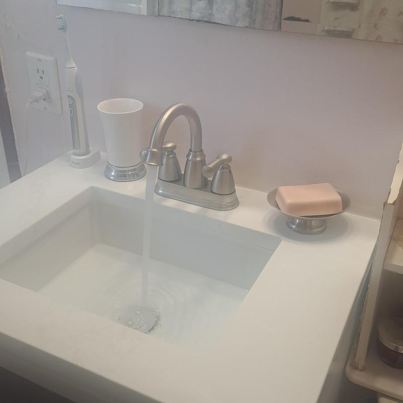 Lavatory sink vanity with faucet and running water