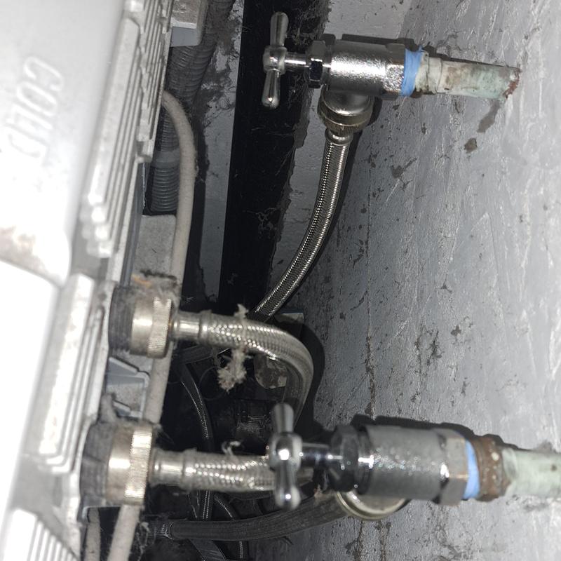 Angle stop valves with braided supply lines on wall