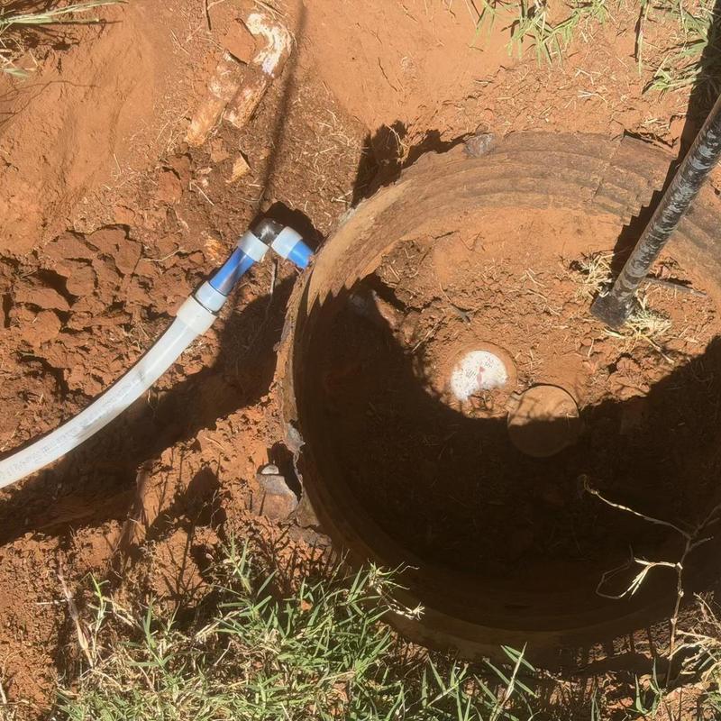 Water service line connection with valve in dirt pit