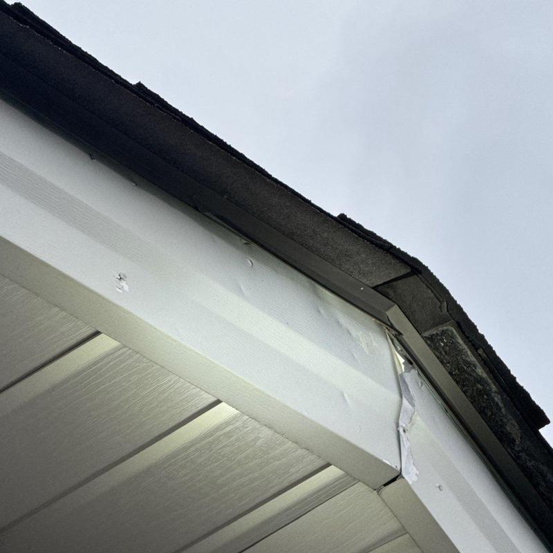 Metal soffit panels with hail damage and dents
