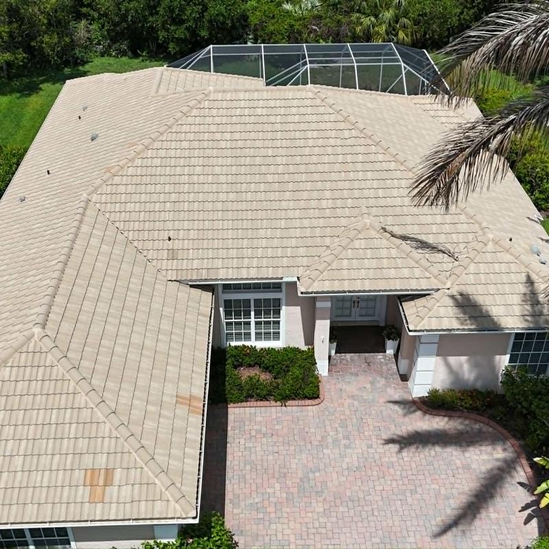 Concrete tile roof with weather damage and stains