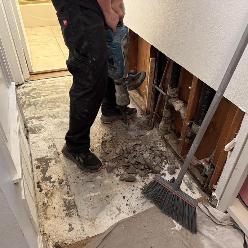 Slab leak repair with jackhammer and exposed pipes Slab leak repair with jackhammer and exposed pipes