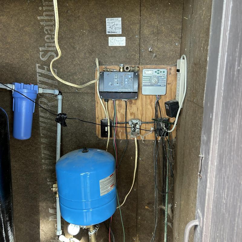 Water softener system with control panel and pressure tank