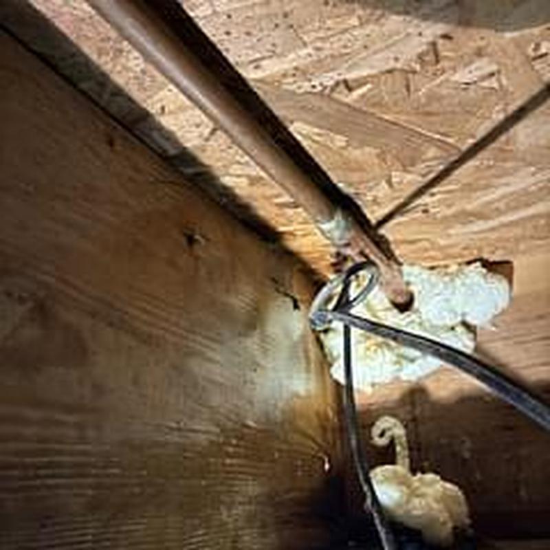 Hose bib water pipe in crawl space with foam seal Hose bib water pipe in crawl space with foam seal