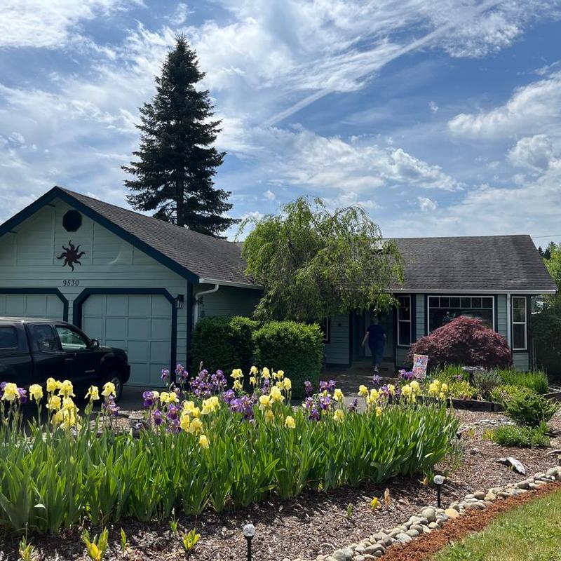 Asphalt shingle roof with garden and driveway in Hayden, ID Asphalt shingle roof with garden and driveway in Hayden, ID