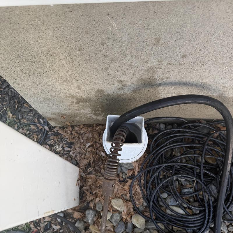 Gutter downspout drain cleaning with auger tool Gutter downspout drain cleaning with auger tool