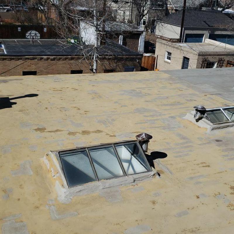 Flat roof with damaged seams and deteriorated jacks Flat roof with damaged seams and deteriorated jacks