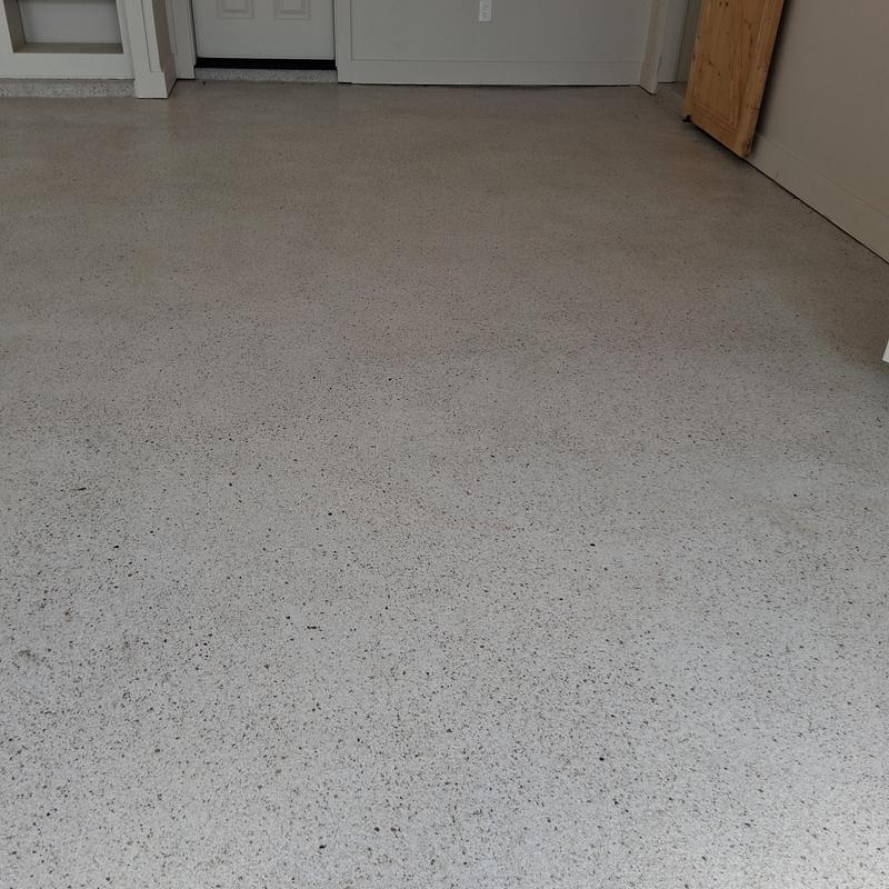 Custom concrete garage floor with speckled finish