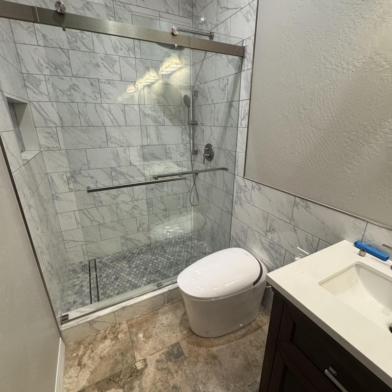 Shower glass door and tile trim installation