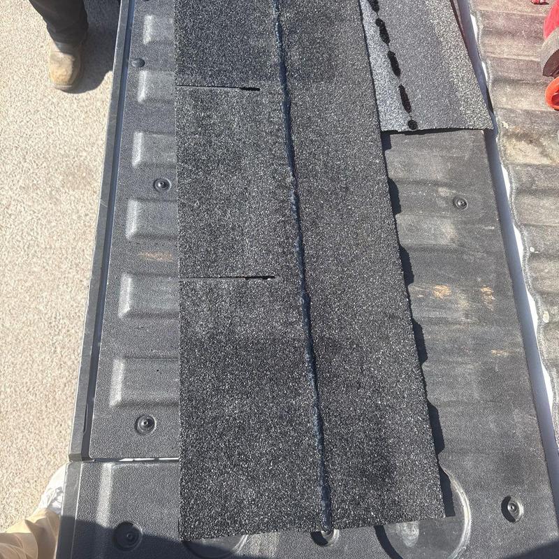 Asphalt shingle roofing inspection on repair table