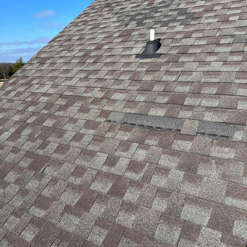 Asphalt shingles with hail damage and missing tabs