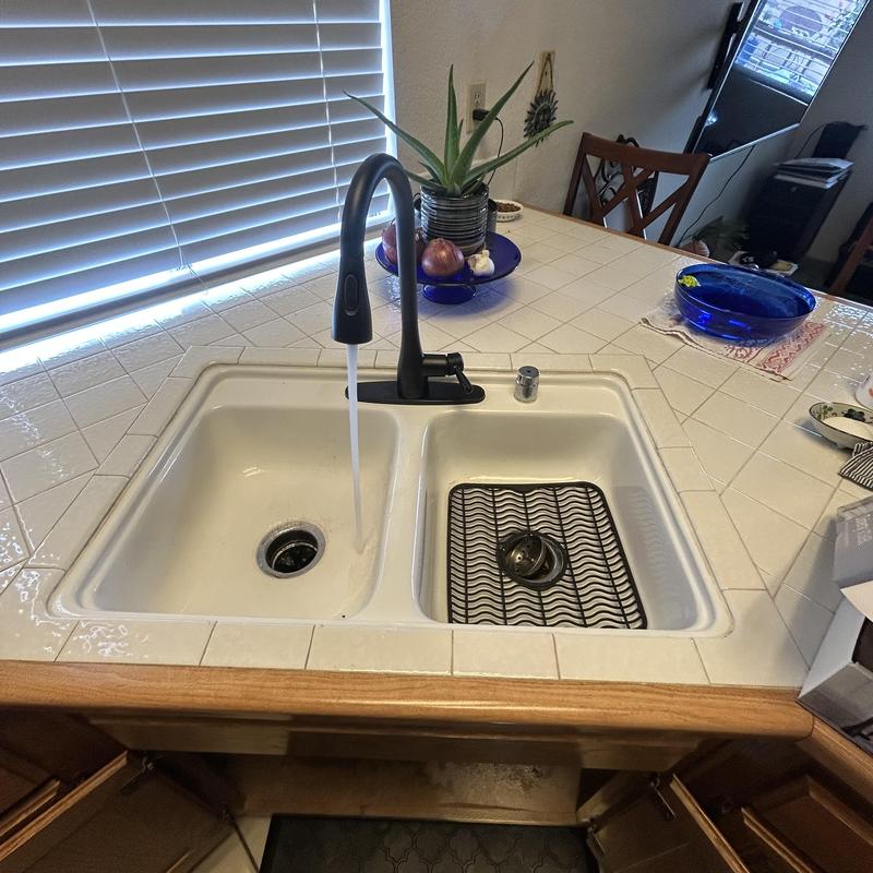 Kitchen faucet installation with running water test