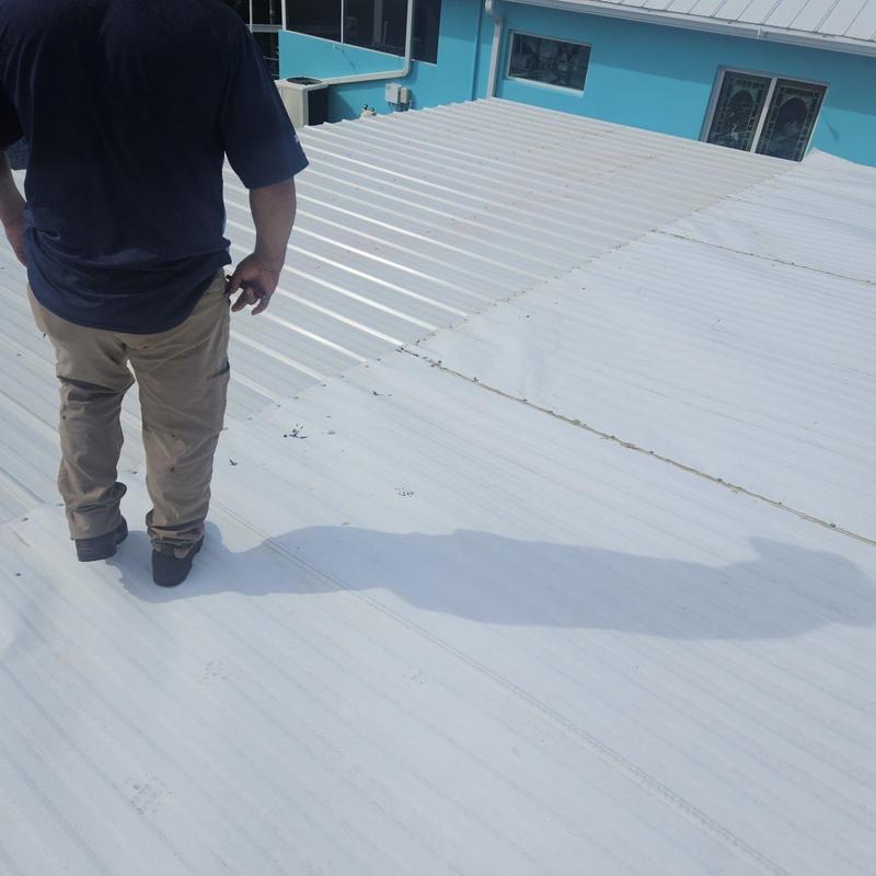 Metal roof panels with signs of wear and gaps