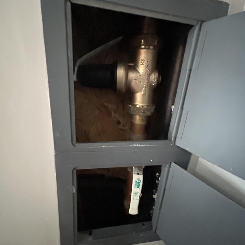 1-14 Pressure regulator valve inside plumbing access panel