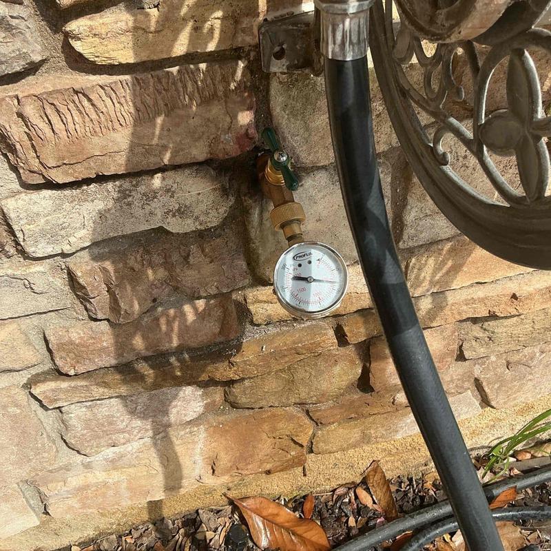 34 in hose bib with pressure gauge on stone wall