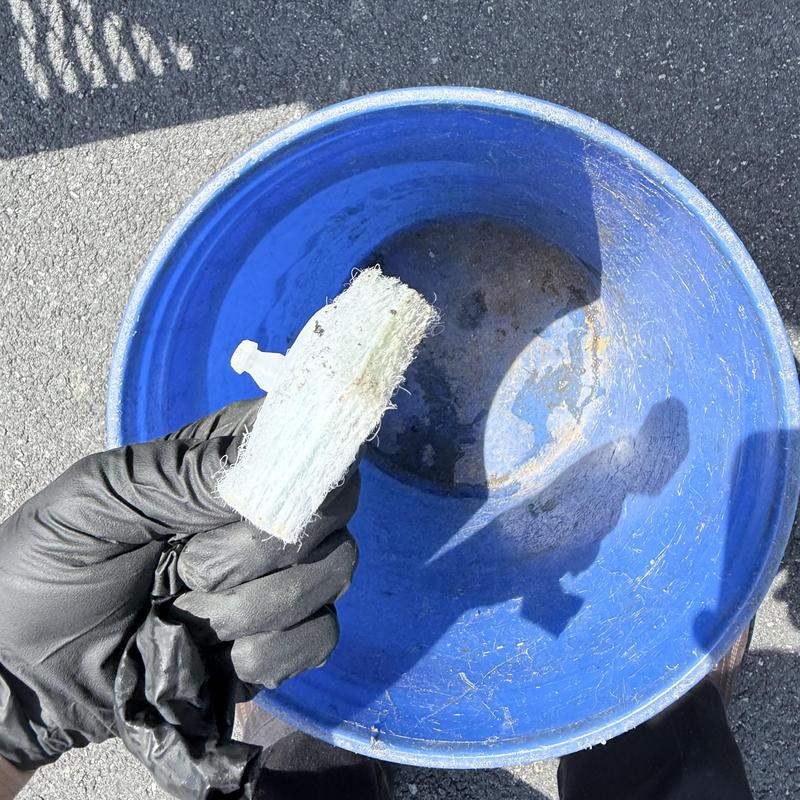 Toilet auger with retrieved blush pod in hand
