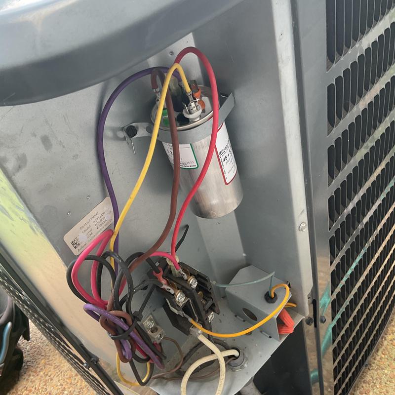 Dual run capacitor with wiring on HVAC condenser unit Dual run capacitor with wiring on HVAC condenser unit
