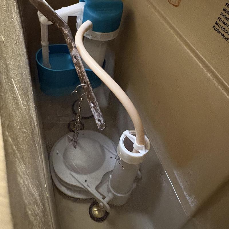 Toilet flush valve and fill valve inside tank