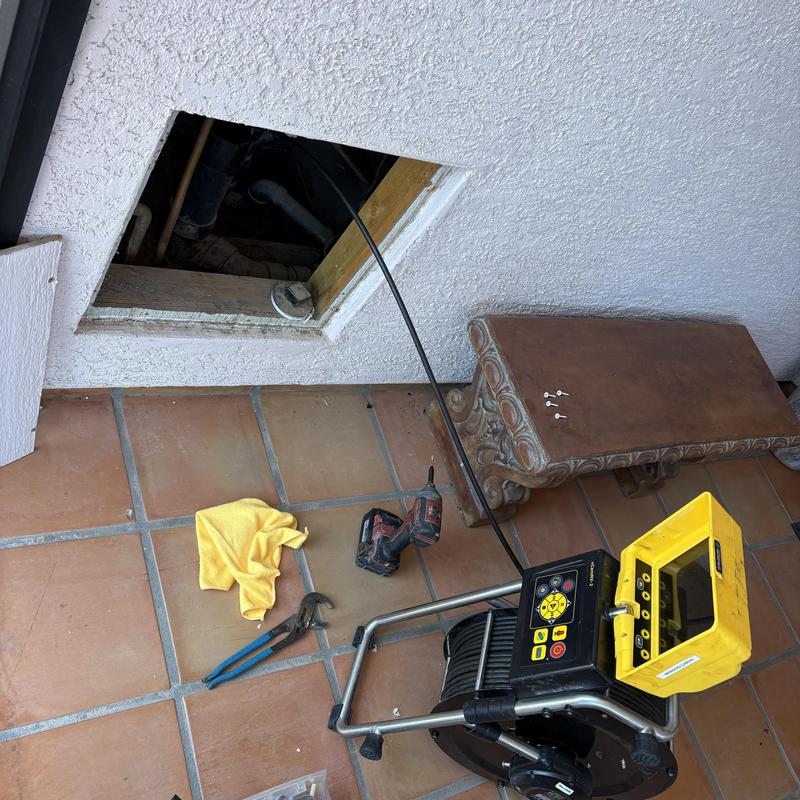 Drain inspection camera setup by wall access panel