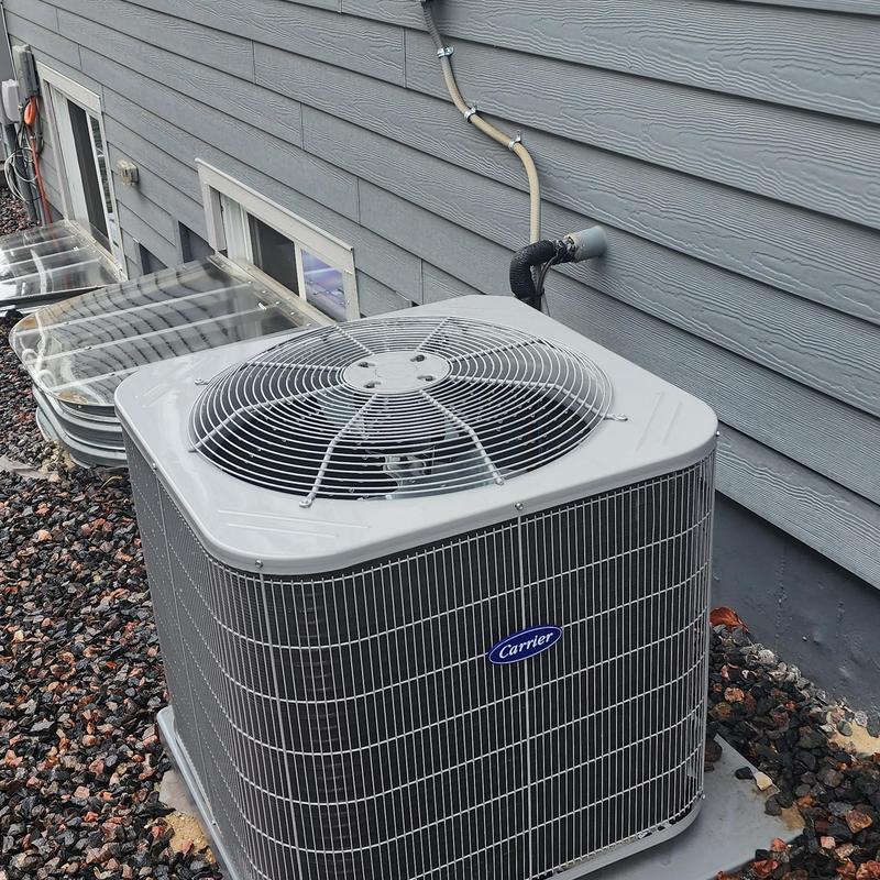 Carrier air conditioner unit installed outdoors