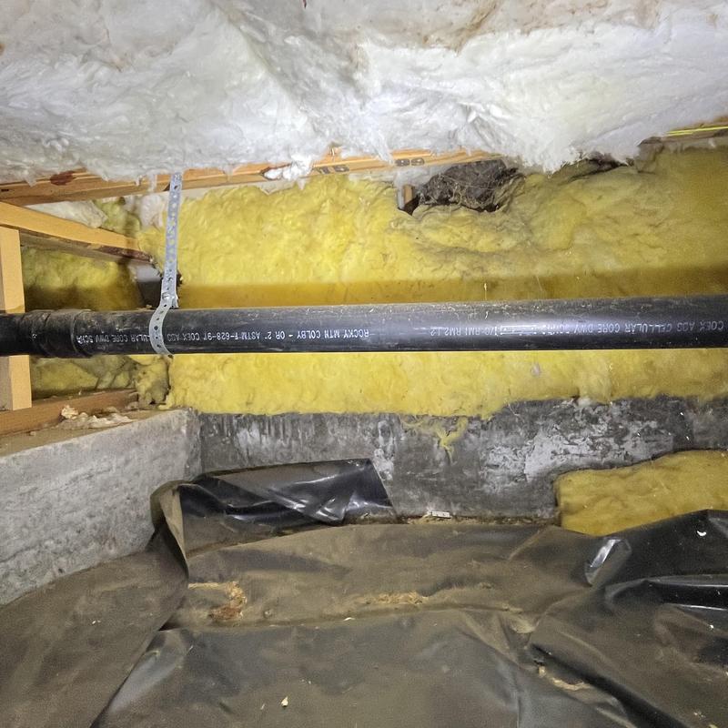 PVC drain pipe in insulated crawl space cavity