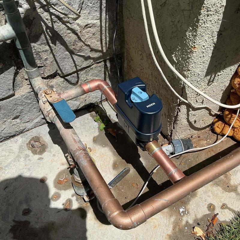 Moen Flo water flow monitoring device installed on pipe