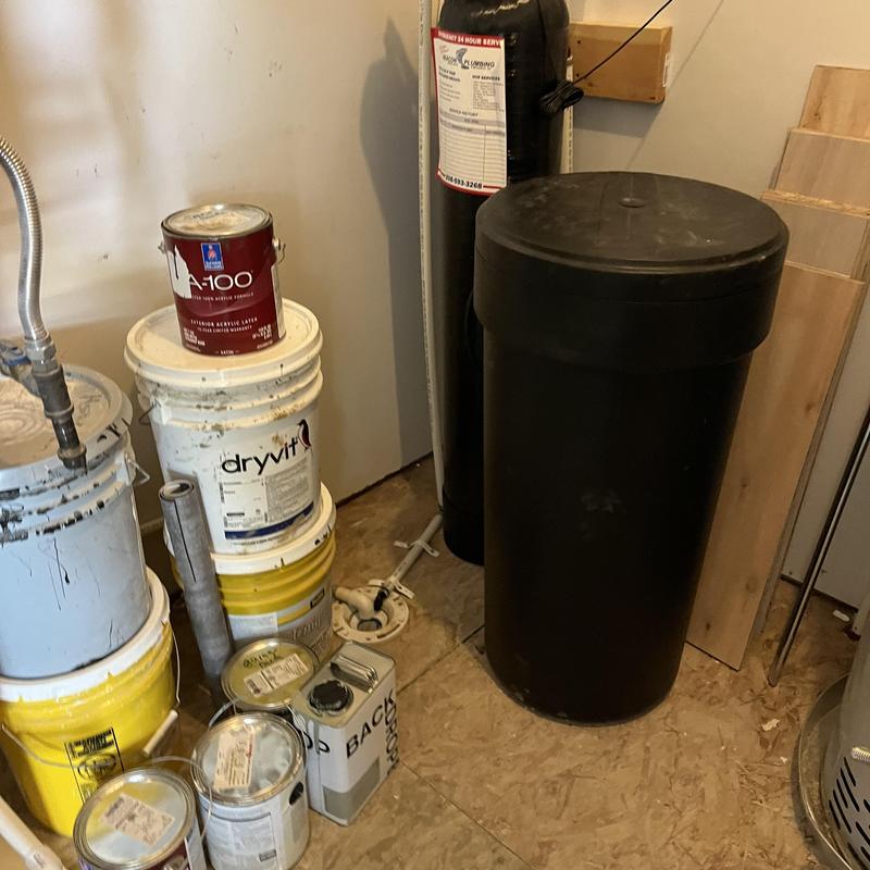 Water softener system with salt replenishment in utility room