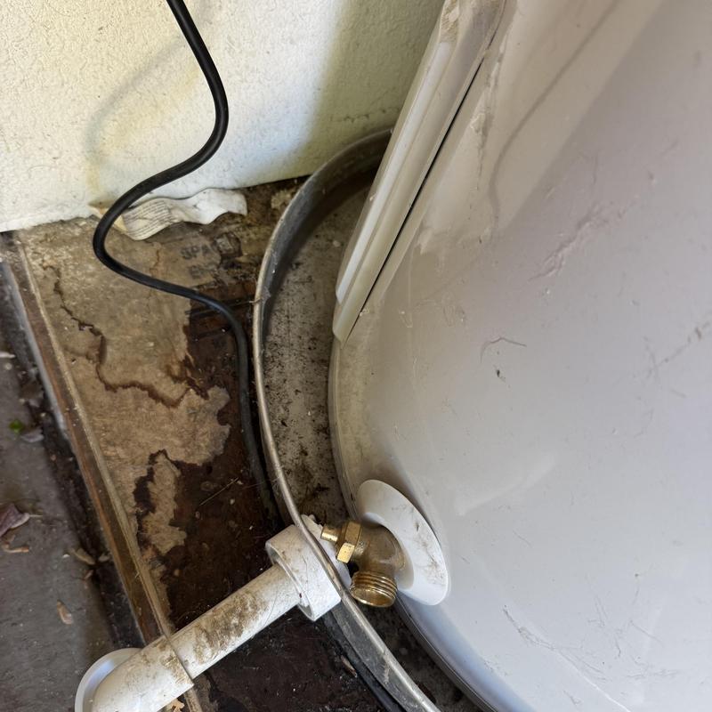 60-gallon high efficiency water heater leak area and piping