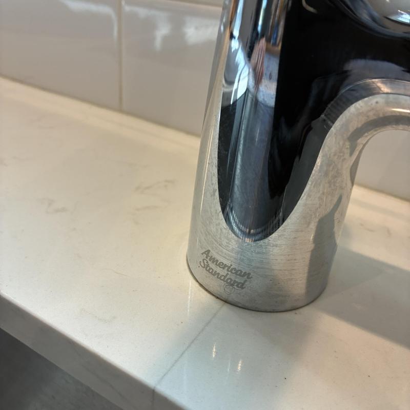 Kitchen faucet base close-up on countertop