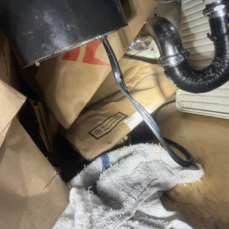 Garbage disposal leaking from base with drips
