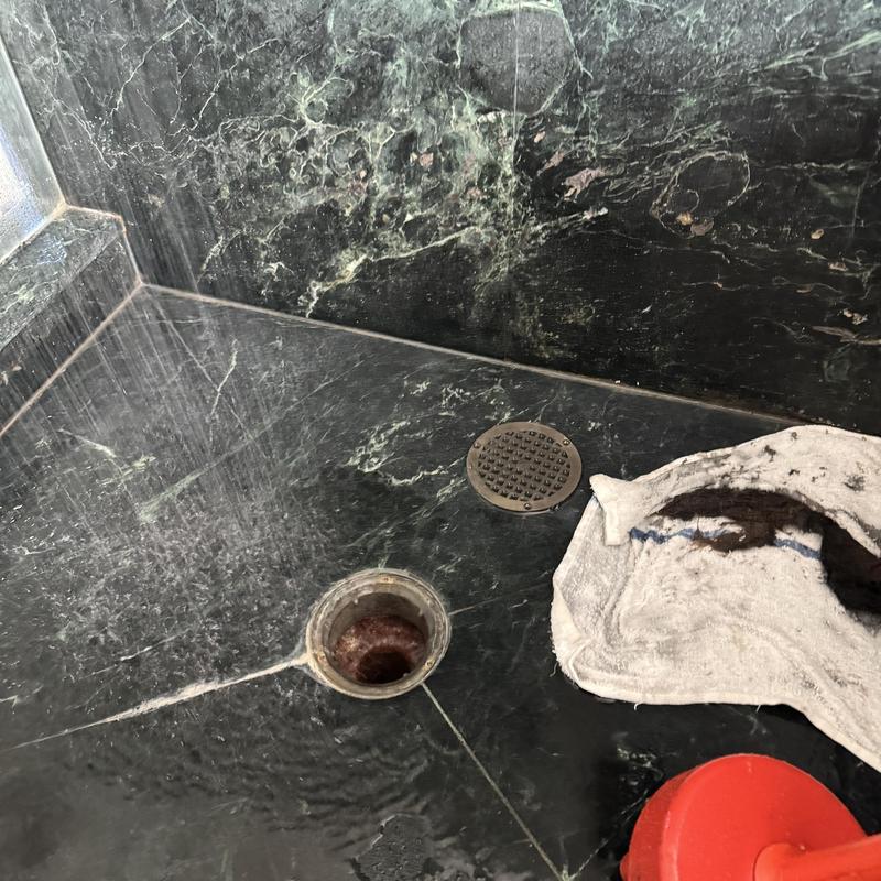 Shower drain with removed hair blockage and tools