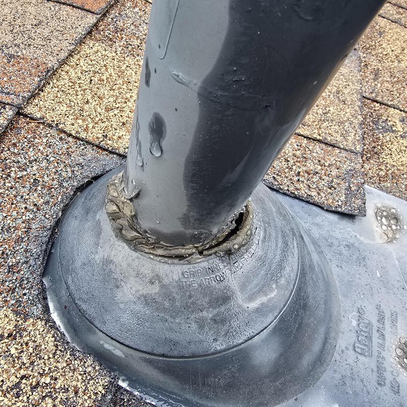 Roof pipe jack with damaged flashing seal on shingle roof Roof pipe jack with damaged flashing seal on shingle roof