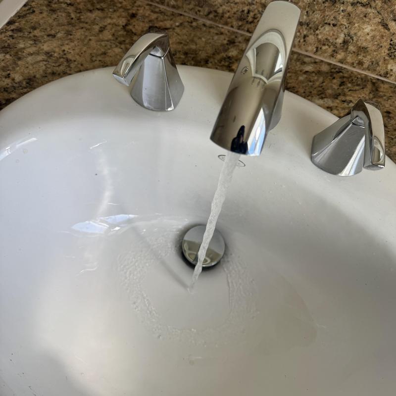 Kitchen sink faucet flow restoration and basin drain clearing