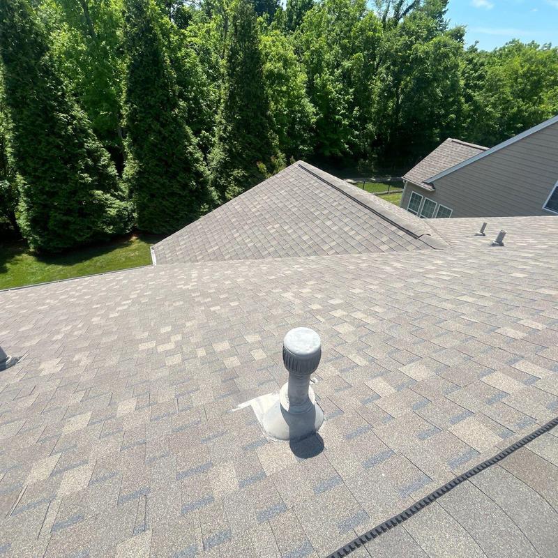 Roof shingles and pipe boot flashing on residential roof