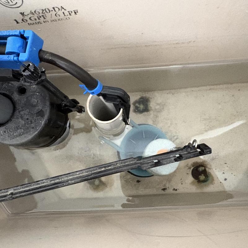 Toilet fill valve and flapper inside tank