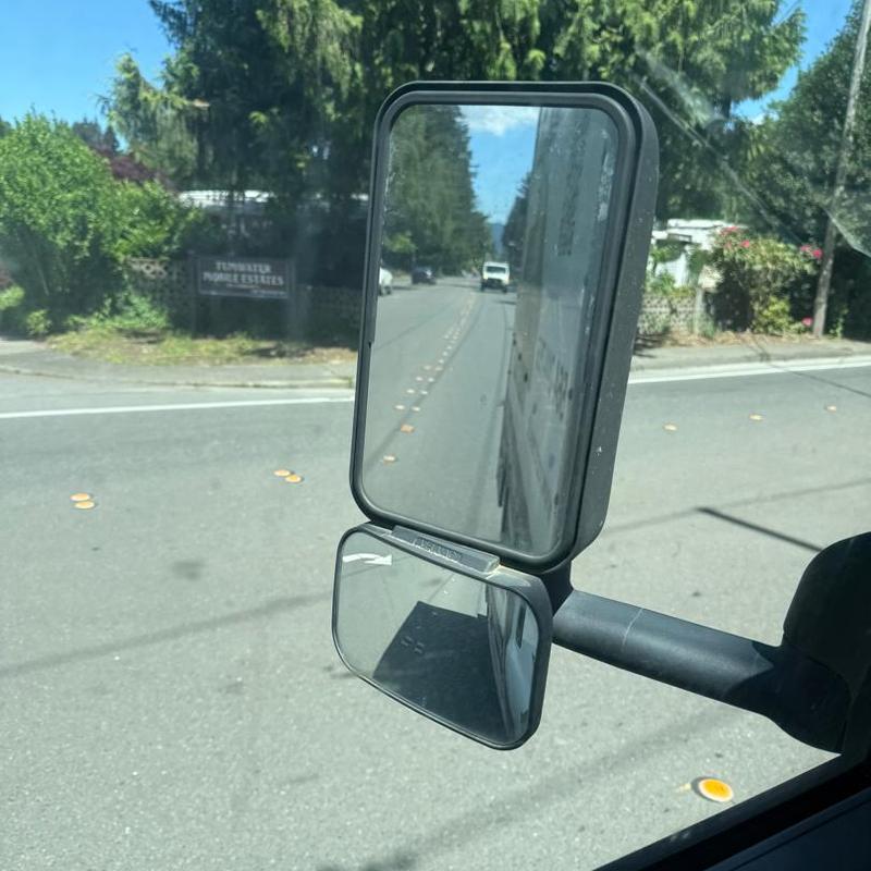 Truck side mirrors reflecting street view