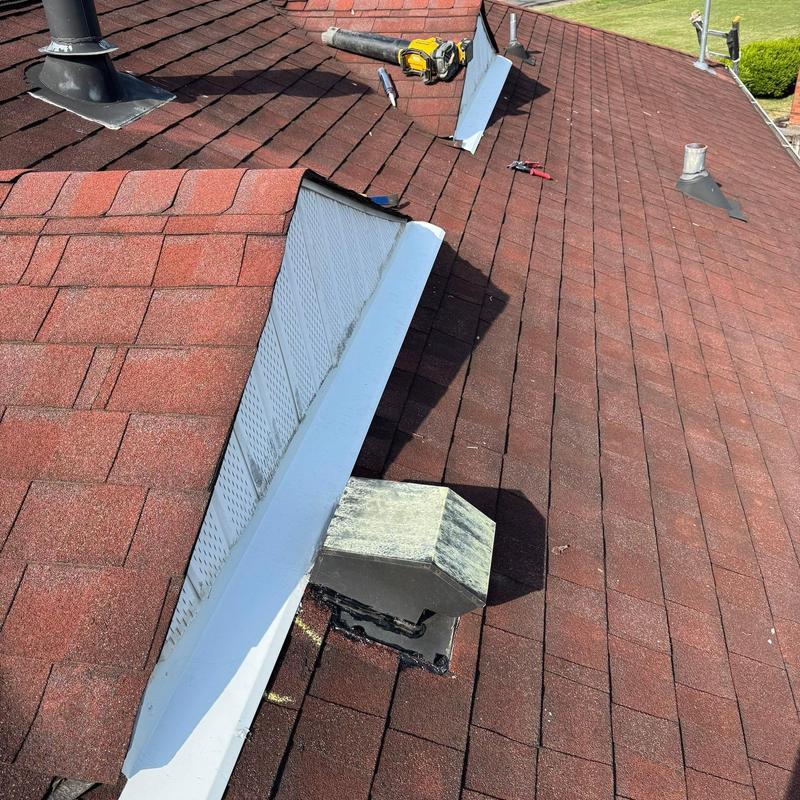 Roof pipe boot with lifted flashing and repair tools