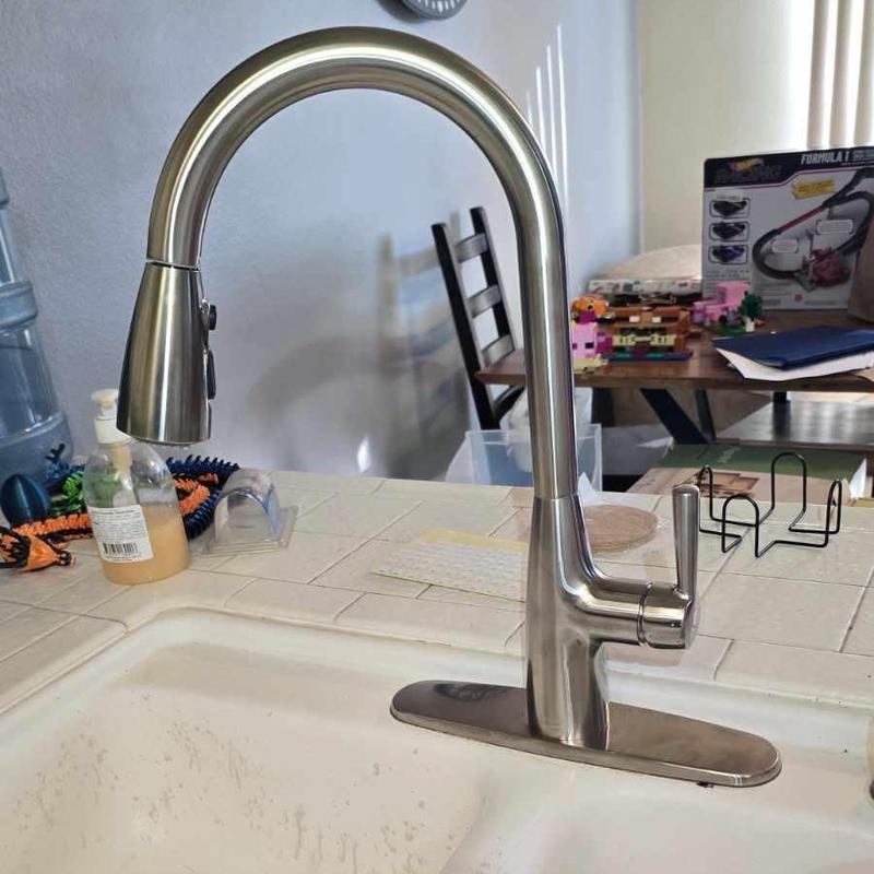 American Standard kitchen faucet installed over sink