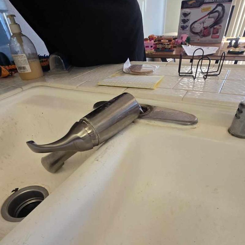 Kitchen faucet detached from sink base