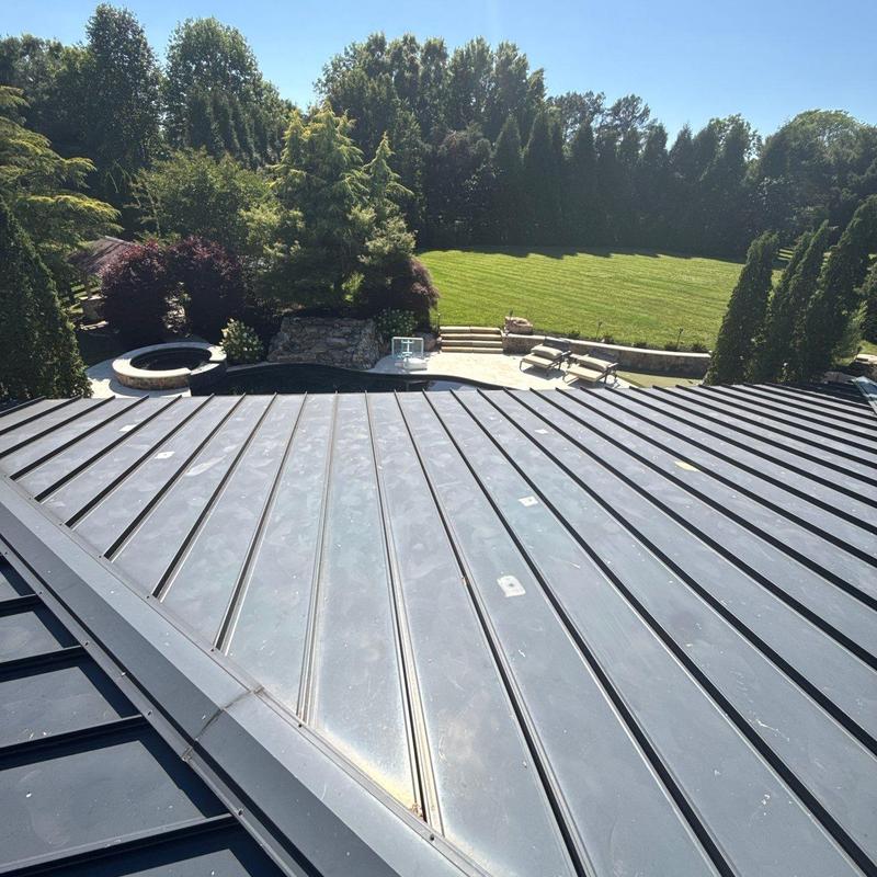 Standing seam metal roof with hail damage markings