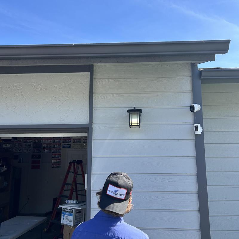 Exterior garage lighting and security camera installation