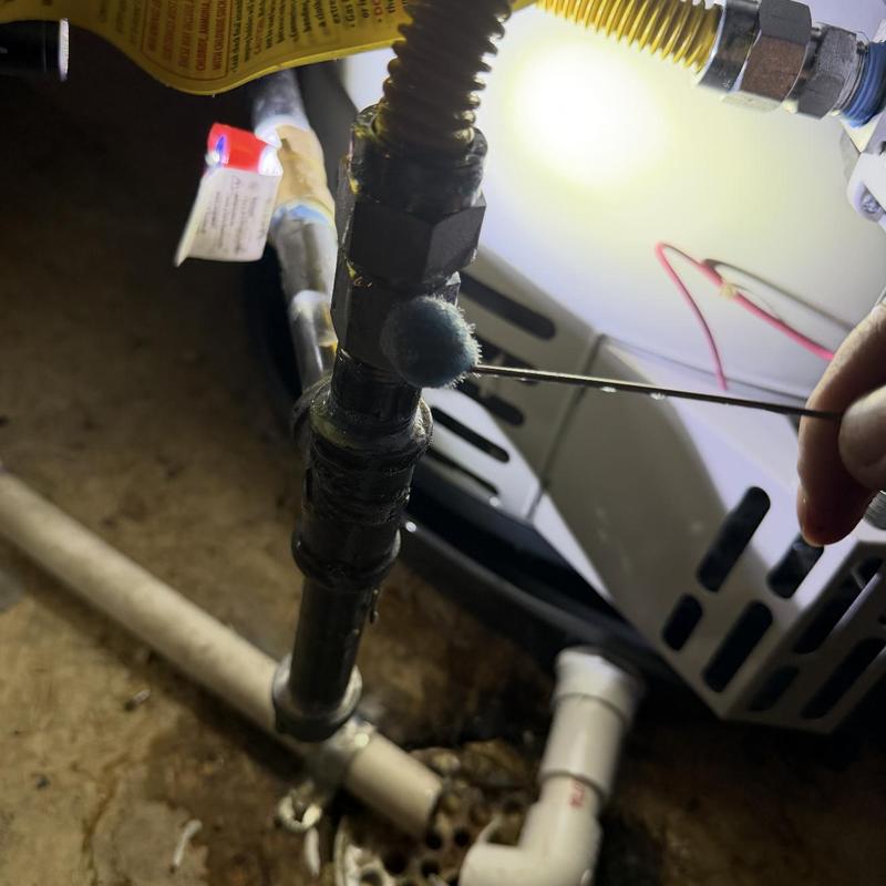 Gas line with leak detection dye near furnace unit Gas line with leak detection dye near furnace unit