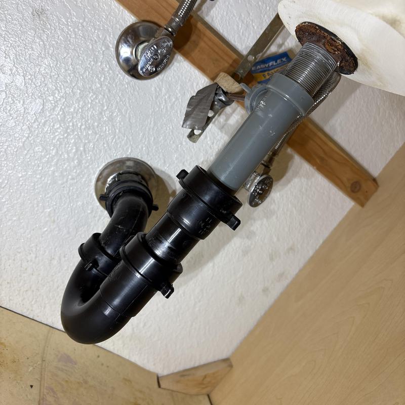 1-1/2 inch P-trap drain pipe under sink with water valves