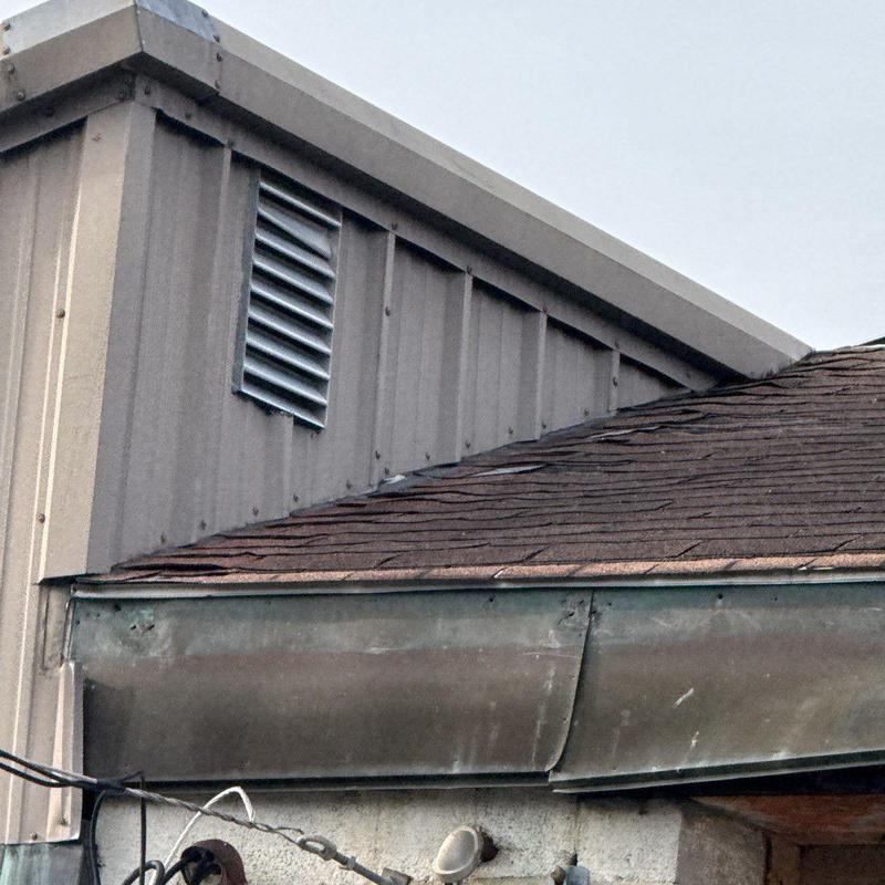 Roof drainage system with hail-damaged gutters and flashing