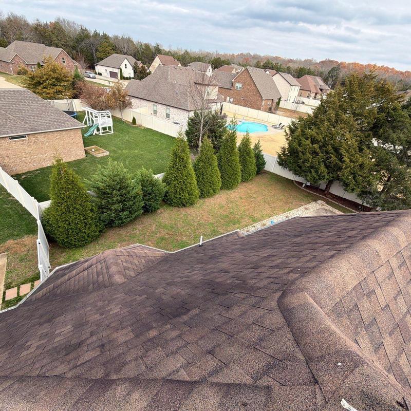 Asphalt shingle roof with hail damage inspection