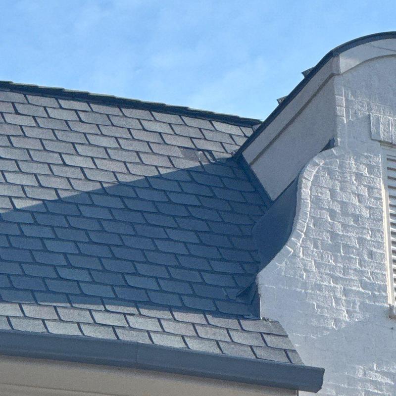 Asphalt shingle roof with hail damage inspection