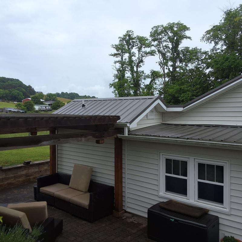 Slate gray metal roof with woodbinder screws installation Slate gray metal roof with woodbinder screws installation