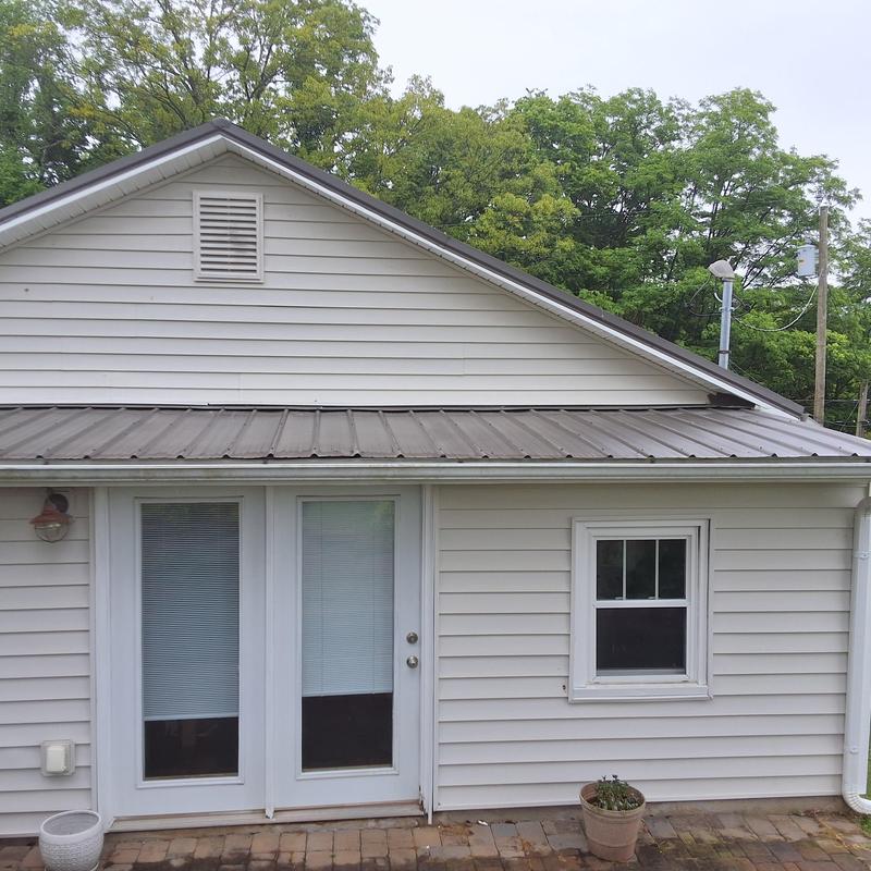 Slate gray metal roof with Woodbinder screws installation Slate gray metal roof with Woodbinder screws installation